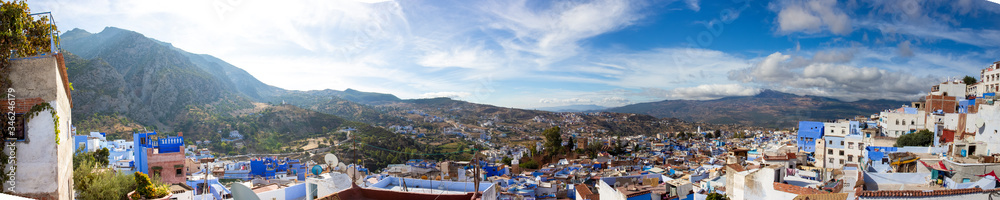 Panoramic view to Chefchaouen town, Morocco. Famous brightly blue painted medina (old town). Idyllic background with Rif mountains and Blue City in the North of Morocco, Africa.
