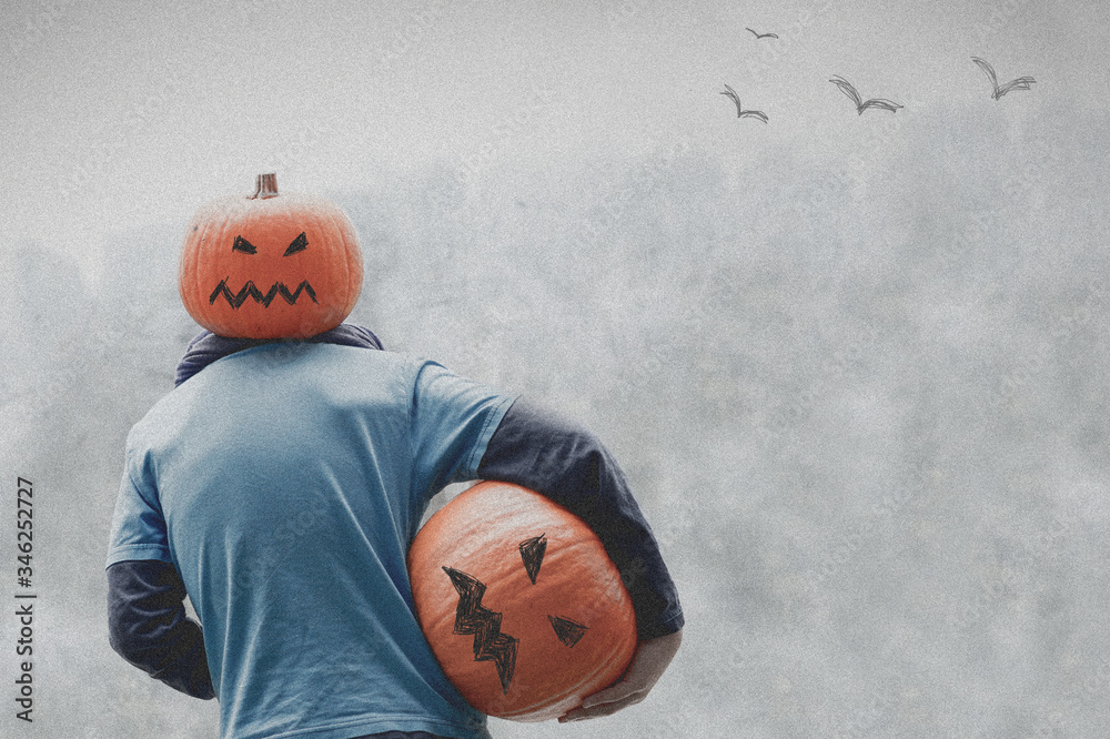 halloween - pumpkin man with pumpkin head and pumpkin in hands. Gray and terrible