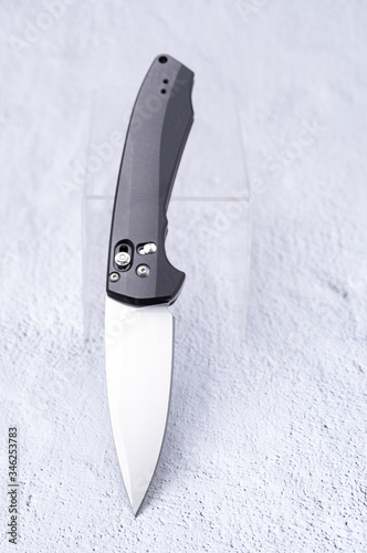 The knife in an upright position is inclined at an angle. photo