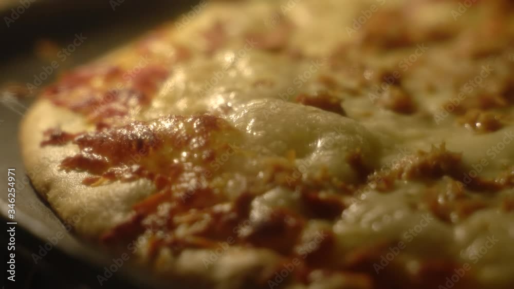 Close-up timelapse of a fresh homemade pizza with cheese melting from oven Heat. Selective focus Close-up timelapse of a fresh homemade pizza with cheese melting from oven Heat. Selective focus
