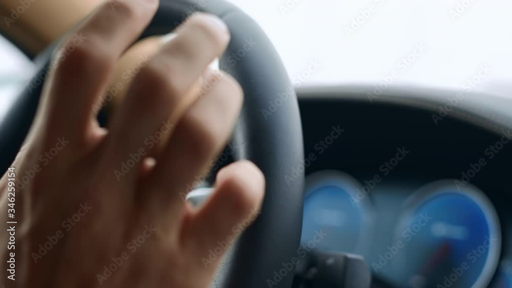 Male Hand Knocking Fingers on Steering Wheel. Man Putting Fingers on