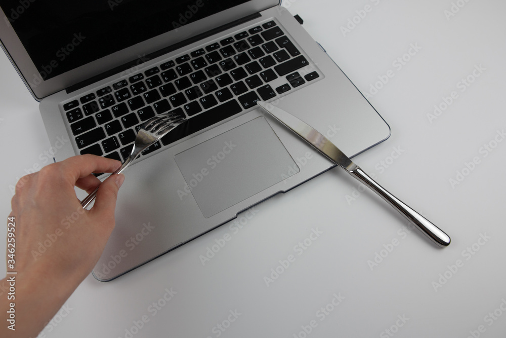 Laptop, fork and knife. Culture of digital information consumption. Netiquette. Laptop, fork and knife. Culture of digital information consumption. Netiquette.