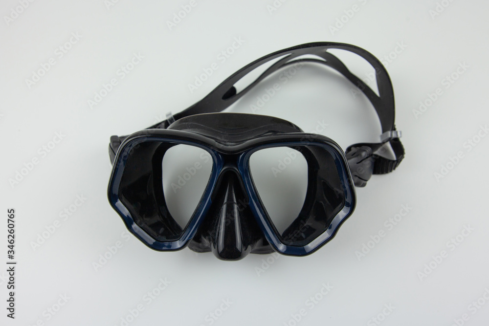 Black mask for snorkeling on a white background. Equipment for outdoor activities Black mask for snorkeling on a white background. Equipment for outdoor activities