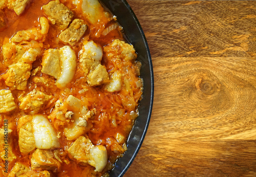 Fried pork in a pan photo