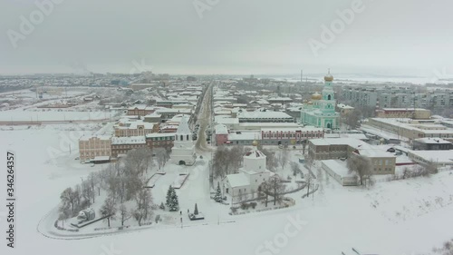Syzran City and Frozen Volga River in Winter on Cloudy Day. Russia. Aerial View. photo