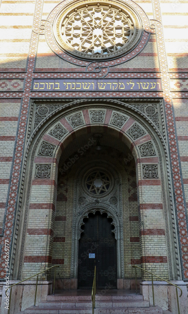 The main entrance to the Dohany Street Synagogue, Budapest with the decorative rose stained-glass window above the doorway.