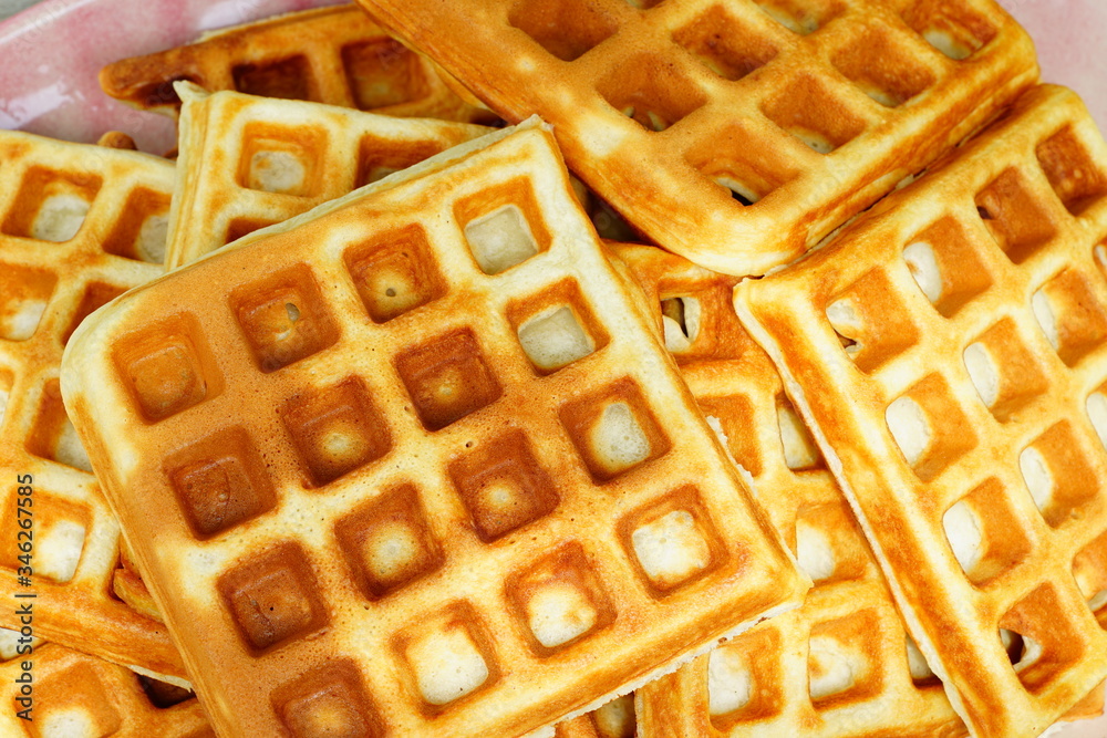 Plate of freshly baked waffles Plate of freshly baked waffles