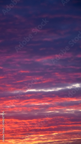 Amazing nature background: dramatic and moody pink, purple and blue cloudy sunset sky shot vertical © kinomaster