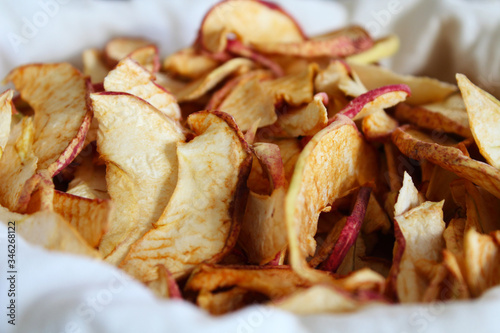 Dried sliced apples in a white bag. Close-up. Background.
