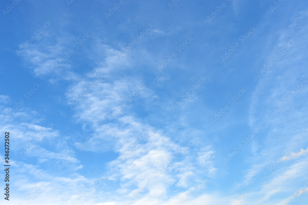 Light translucent cirrus clouds high in a blue spring or summer sky on a sunny day. Meteorology, weather and different cloud types.