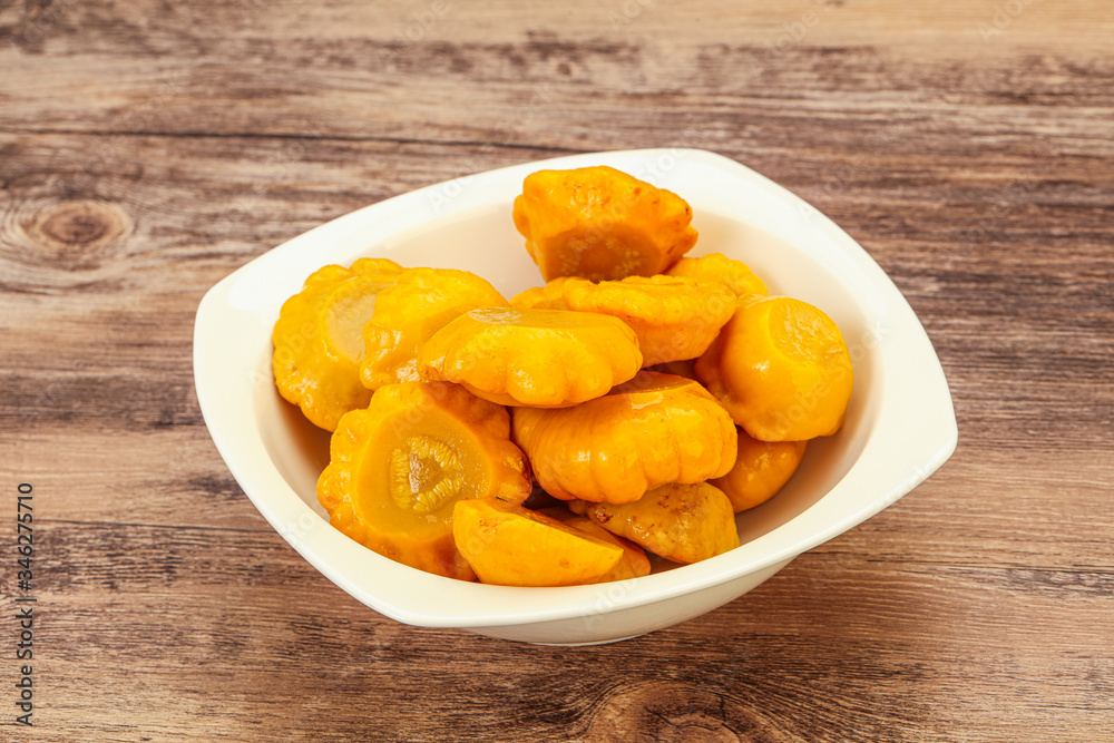 Marinated yellow patisson in the bowl