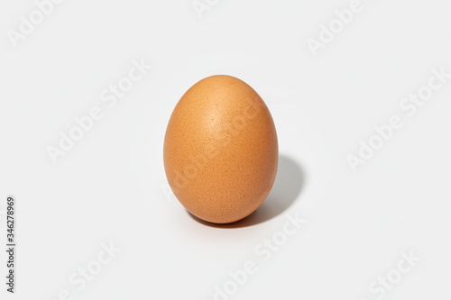 Chicken brown egg isolated on white background