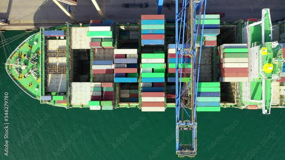 Container Loading Go Down Aerial drone top down video of loading/unloading containers by using ...