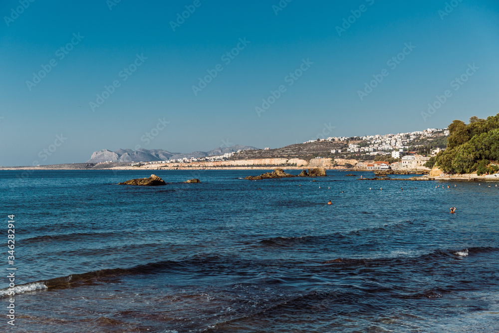 beautiful greek bay with a boat on the water