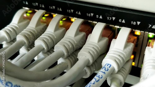 Close up of Server Switch Ethernet with Lights Blinking and Cables