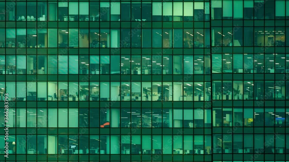 timelapse. modern office building in the evening. windows timelapse. modern office building in the evening. windows