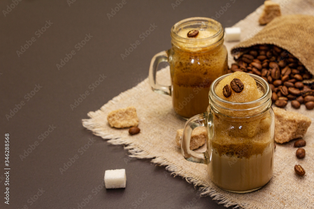 Dalgona coffee in mason jar. Korean fluffy whipped coffee beverage Dalgona coffee in mason jar. Korean fluffy whipped coffee beverage
