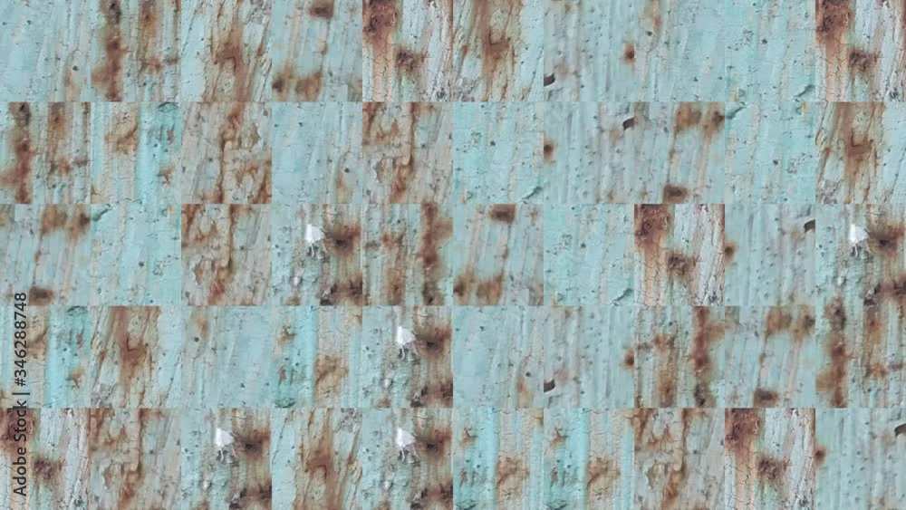 Abstract video of mosaic textures from the elements of a metal wall in blue paint with rusty spots. Background design. Backdrop. Wallpaper. Abstract video of mosaic textures from the elements of a metal wall in blue paint with rusty spots. Background design. Backdrop. Wallpaper.