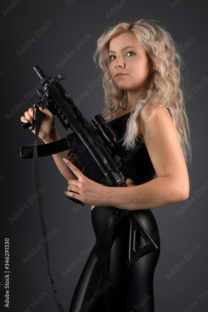 beautiful sexy girl holding gun 