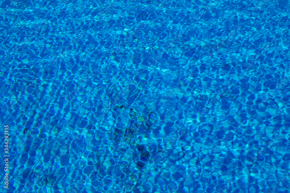 Blue and crystalline water of a swimming pool Blue and crystalline water of a swimming pool