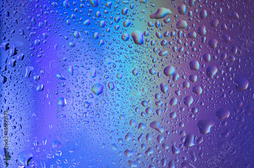 Violet-blue gradient with drops on glass. Background with water drops. Blue background with water drops.