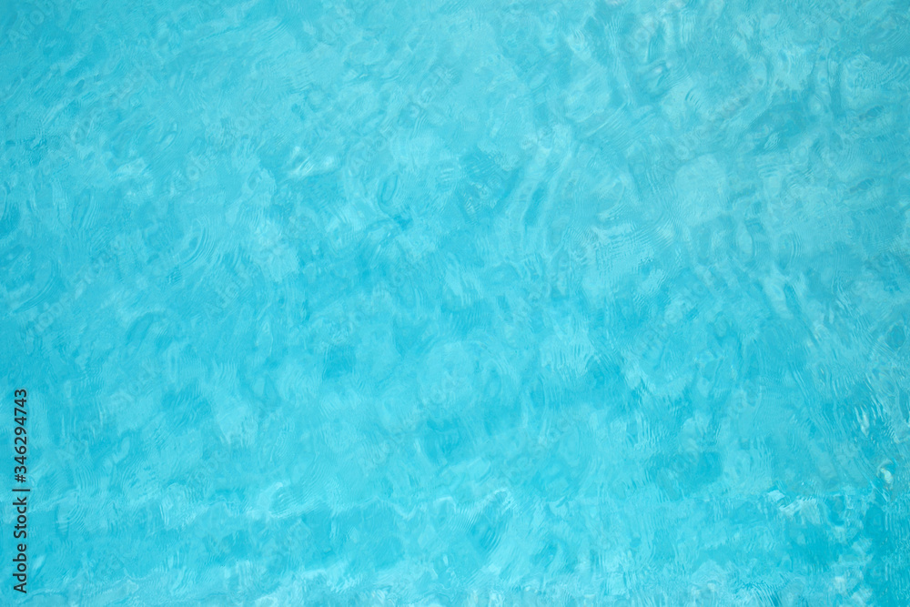 Blue and crystalline water of a swimming pool