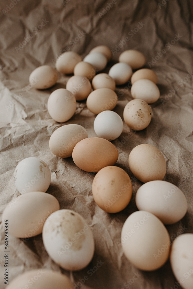 Many dirty eggs on craft paper background Many dirty eggs on craft paper background