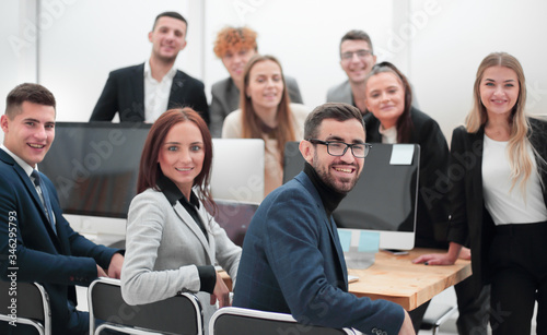 group of successful young employees in the workplace in the office