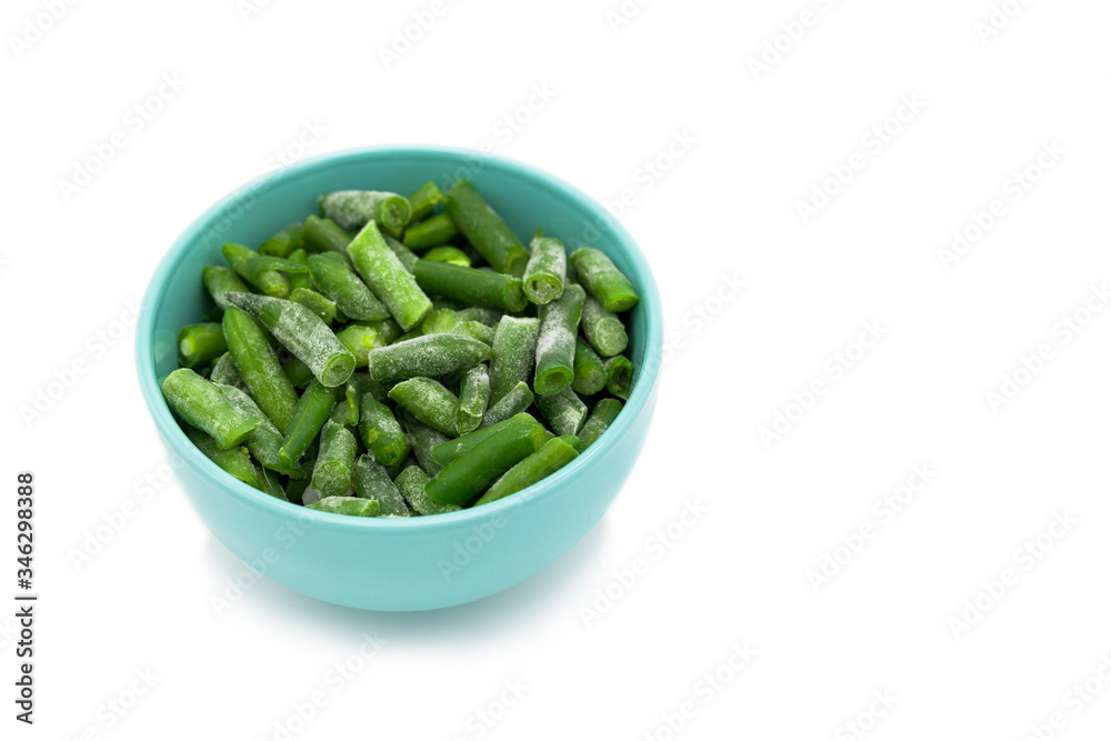 A plate of frozen vegetables, asparagus, on a white background isolated A plate of frozen vegetables, asparagus, on a white background isolated