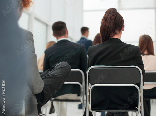 seminar participants ask questions at a business meeting