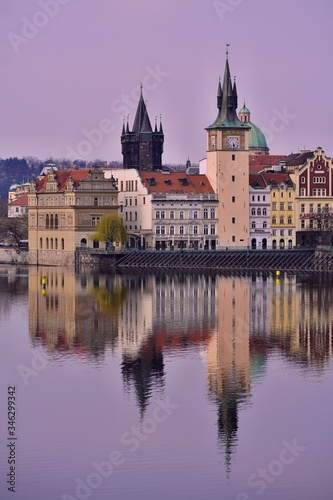 View of the Old Town pier architecture and Charles Bridge over Vltava river in Prague, Prague castle, Czech Republic in Covid 19 without people