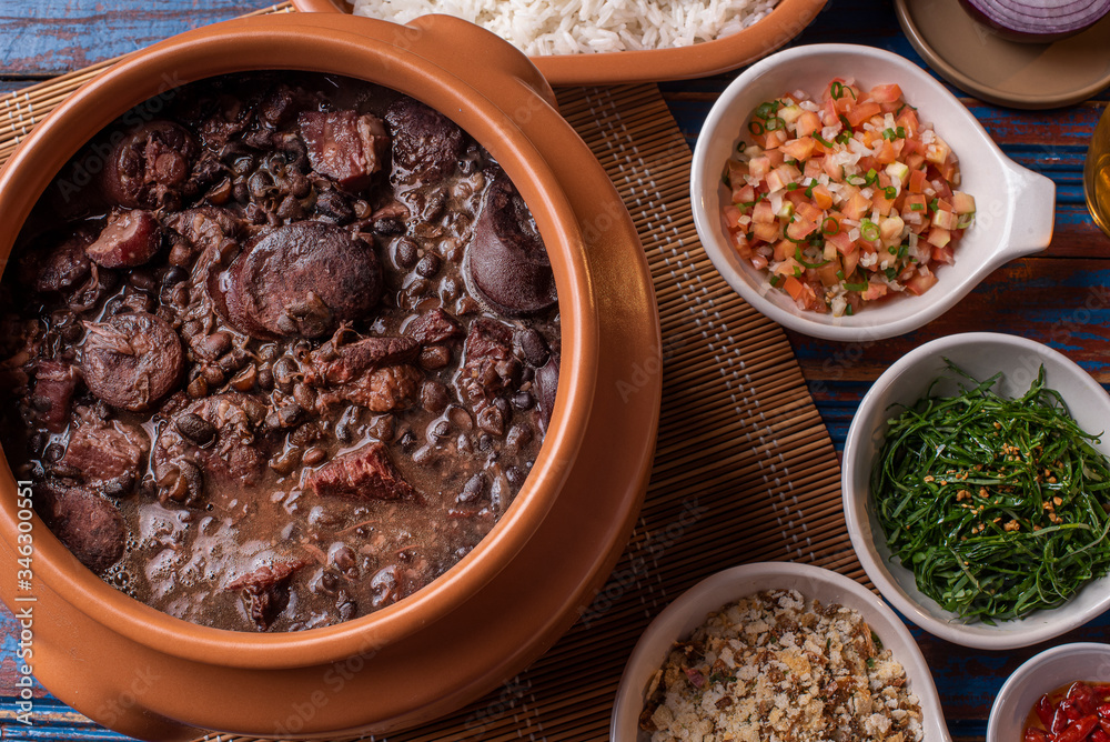 Feijoada. Typical Brazilian food with black beans, pork meat and sausage
Feijoada. Typical Brazilian food with black beans, pork meat and sausage