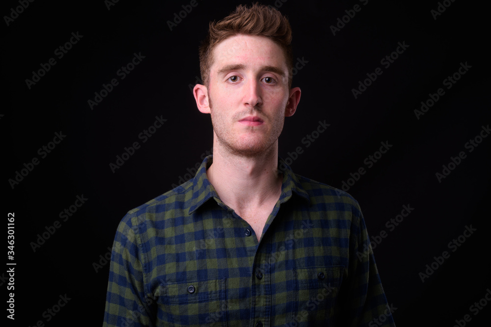 Face of young handsome hipster man looking at camera Face of young handsome hipster man looking at camera