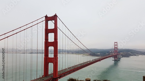 Low Angle View Of Golden Gate Bridge Over Sea Against Clear Sky #346304547