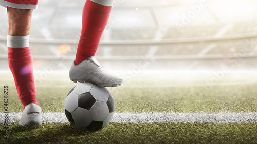 Soccer closeup. Leg of soccer player on the ball. Soccer background.