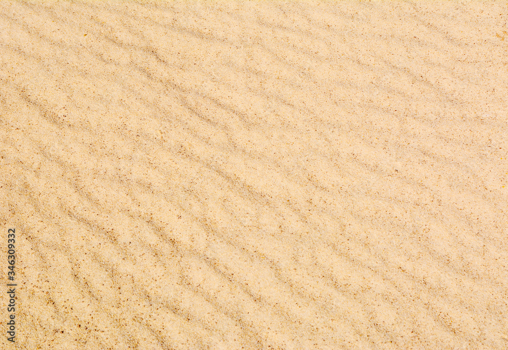 Sand texture with waves. Yellow sand. Background from fine sand. Sand texture with waves. Yellow sand. Background from fine sand.