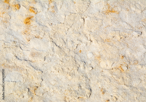 Close up yellow and white sand. Natural texture for background. © olenatur