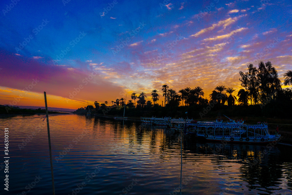 Naklejka premium Luxor. Nile river in Egypt. Sunset over the river in Egypt. Sunset in Luxor