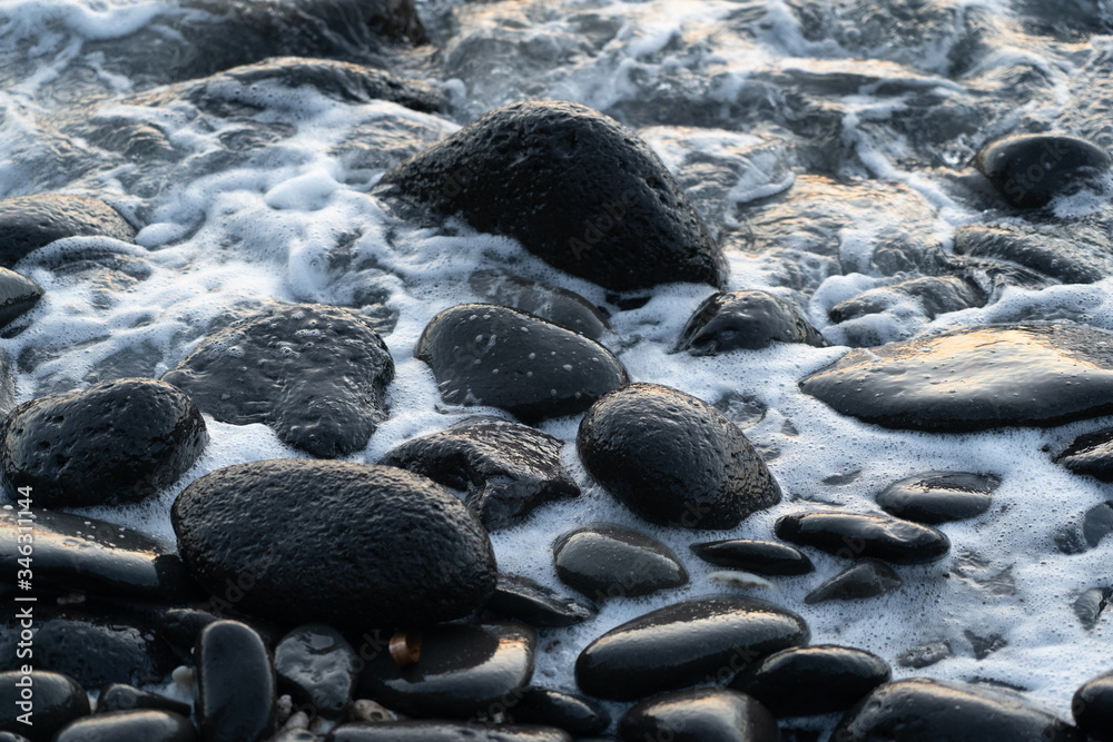 Sea foam on Black rocks Sea foam on Black rocks