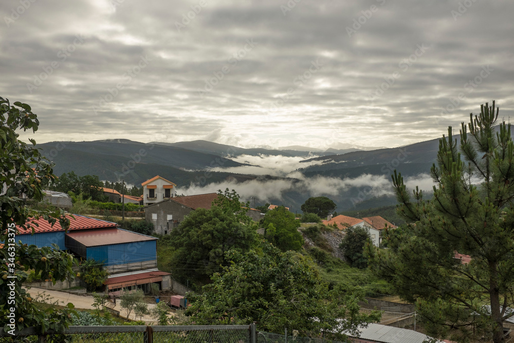 Overlooking Esporao village and countryside in rural Portugal wih low stratus clouds in the valleys