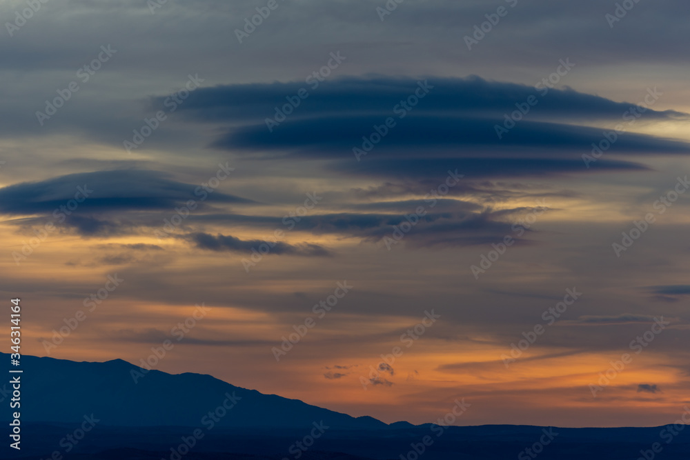 Lenticular clouds at sunset in the sky of Andalusia