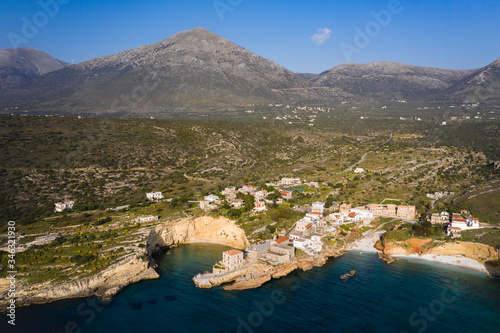 Aerial birds eye view photo taken by drone of fishing village of Mezapos with blue clear waters, Mani, Laconia, Peloponnese, Greece