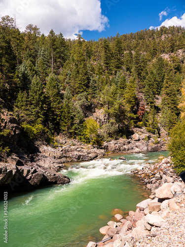 The Narrow Gauge Railway from Durango to Silverton that runs through the Rocky Mountains by the River Animas In Colorado USA