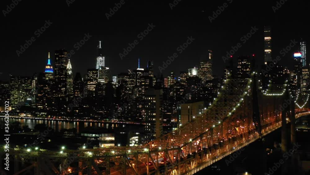 Aerial shot of New York City above East river showing Manhattan by night Aerial shot of New York City above East river showing Manhattan by night