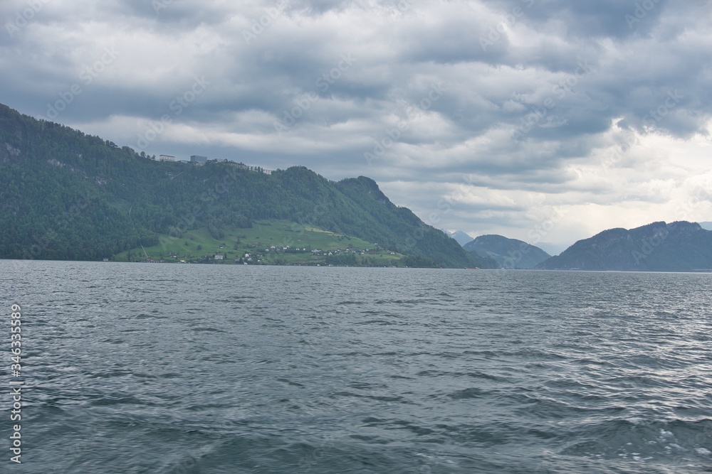 Scenic view of snow covered Alps mountains from Lake Lucerne in Luzern, Switzerland Scenic view of snow covered Alps mountains from Lake Lucerne in Luzern, Switzerland