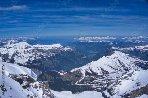 Panoramic view of glaciers and alps mountain range from the top of Jungfrau peak in Switzerland
