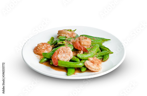 Stir fried green peas with shrimp on dish isolated on white background