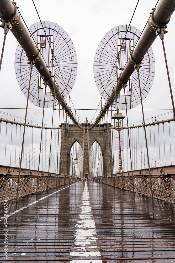 Fototapeta premium Brooklyn bridge. Rainy Brooklyn bridge view. Brooklyn bridge close up view. Rainy day at Brooklyn bridge. 
