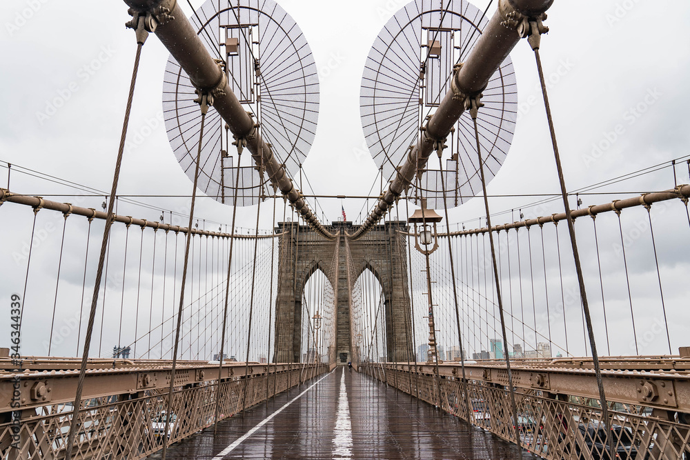 Fototapeta premium Brooklyn bridge. Rainy Brooklyn bridge view. Brooklyn bridge close up view. Rainy day at Brooklyn bridge. 