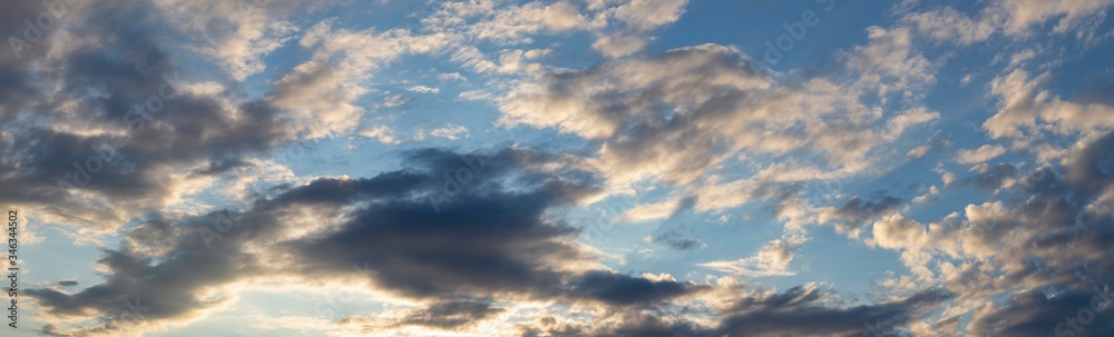 Purple-magenta clouds. Cirrus cloudscape on blue sky.Tragic gloomy sky. Landscape with bloody sunset. Fantastic skies on the planet earth.